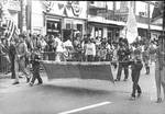 Boy Scouts carry the Our Lady of Fatima Church banner in the Columbus Day Parade