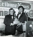 Buddy Fortunato presents the Italian Tribune News Journalistic Award to Anthony Zoppi during the 1976 Columbus Day Dinner