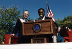 Ace Alagna and speaker at the podium of the 1995 Columbus Day Parade
