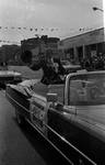 Grand Marshall Phil Brito waves his hat from the car in the 1973 Columbus Day Parade