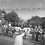 Geraldine Ferraro waves from the dias at the 1984 Columbus Day Parade
