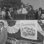 Frankie Avalon, Ace Alagna and others listen as Governor Thomas Kean speaks at the Columbus Day Parade