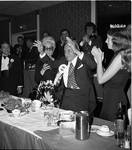 Miss Columbus Day and others applaud Grand Marshall Donato Rizzolo at the 1972 Columbus Day Dinner
