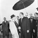 Vice President Hubert Humphrey  shakes hands under an umbrella during 1966 tour of New Jersey