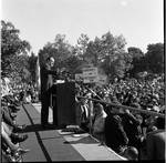 Side view of Vice President Hubert Humphrey  delivering a speech to the crowd during 1966 tour of New Jersey