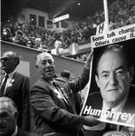 Holding a Hubert Humphrey poster at the 1968 Democratic National Convention, Chicago, Illinois