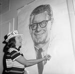 Signing a poster of Governor  Richard Hughes at the 1968 Democratic National Convention, Chicago, Illinois