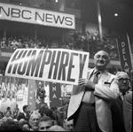 Holding a Humphrey sign at the 1968 Democratic National Convention, Chicago, Illinois
