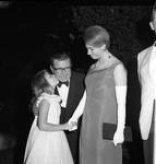 Princess Christina of Sweden shakes hands with a young girl as she greets Governor Richard Hughes
