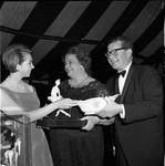 Princess Christina of Sweden, Governor Richard Hughes, and Mrs. Elizabeth Murphy Hughes exchange gifts