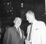 Jack Warner standing with man