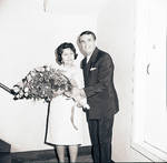Robert Alda handing flowers to Mrs. Maria Lanza