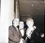 Shelly Winters shaking hands with two men