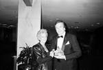 Danny Aiello at National Italian American Foundation dinner, holding award, with wife