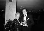 Danny Aiello at National Italian American Foundation dinner, holding award, with wife