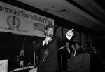 Joe Piscopo standing on stage with mic in hand speaking  during Italian Sports Hall of Fame at the Sheraton Meadowlands
