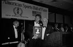 Joe Piscopo with an award on stage with Lou Duva during Italian Sports Hall of Fame at the Sheraton Meadowlands