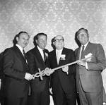 Lawrence Welk with group of men holding a caduceus at an American Cancer Society event