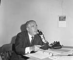 Peter W. Rodino at his desk taking a phone call