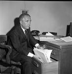 Peter W. Rodino working with files in office