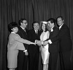 Eydie Gorme and Steve Lawrence with bride and groom and group holding hands  at Westwood Restaurant