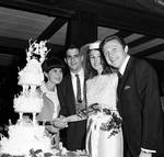 Eydie Gorme and Steve Lawrence with bride and groom cutting the cake at Westwood Restaurant