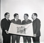 Holding the state flag of New Jersey