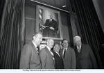 Peter W. Rodino, Walter Mondale, Tip O'Neill, and others stand before Rodino's portrait in the Judiciary Committeeï¿½s chambers