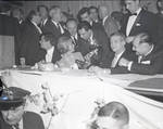 Janet Leigh speaks over her shoulder to Ace Alagna with Tony Curtis and others