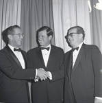 Senator Ted Kennedy watches as Robert J. Burkhardt shakes hands with Governor Richard Hughes