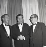 Robert J. Burkhardt looks on as Senator Ted Kennedy and Governor Richard Hughes shake hands