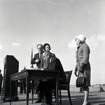 President Lyndon B. Johnson signs the 1965 Immigration Bill at Liberty Island as Vice-President Hubert Humphrey, Lady Bird Johnson and Muriel Humphrey  watch