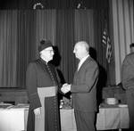 Msgr. Dooley shakes hands at an event for St. Francis Xavier, Newark, NJ