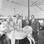 Brendan Byrne and others pose with a donkey at a political breakfast at Don's 21