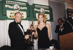 Ace Alagna presents Miss Columbus Day 1997 with a trophy by Ace (Armando) Alagna, 1925-2000