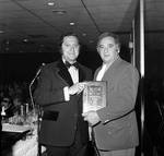 Lawrence Biase is presented with his service community award at the 1972 Columbus Day Dinner by Ace (Armando) Alagna, 1925-2000