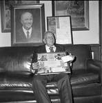 Grand Marshall Donato Rizzolo holds memorabilia at the 1972 Columbus Day Dinner by Ace (Armando) Alagna, 1925-2000