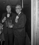 Thomas Campione receives his community service award at the 1972 Columbus Day Dinner by Ace (Armando) Alagna, 1925-2000