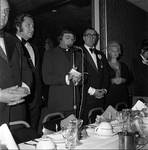 Father Eugene Marcone delivers the prayer at the 1972 Columbus Day Dinner by Ace (Armando) Alagna, 1925-2000