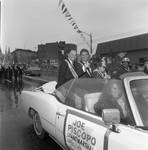 Grand Marshall Joe Piscopo rides with Ace Alagna at the 1987 Columbus Day Parade by Ace (Armando) Alagna, 1925-2000