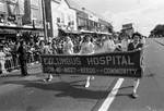 Columbus Hospital banner being carried in the 1974 Columbus Day Parade by Ace (Armando) Alagna, 1925-2000
