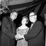 Princess Christina of Sweden poses with Governor Richard Hughes and priest by Ace (Armando) Alagna, 1925-2000