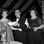 Princess Christina of Sweden, Governor Richard Hughes, and Mrs. Elizabeth Murphy Hughes exchange gifts by Ace (Armando) Alagna, 1925-2000