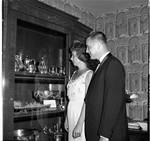 Admiring a display at a reception for Princess Christina of Sweden by Ace (Armando) Alagna, 1925-2000