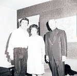 Toni Dalli and Mrs. Maria Lanza standing with priest by Ace (Armando) Alagna, 1925-2000