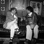 Frank Longella on couch talking with a man by Ace (Armando) Alagna, 1925-2000