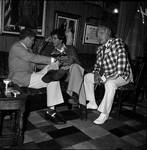 Frank Longella on couch talking with man by Ace (Armando) Alagna, 1925-2000