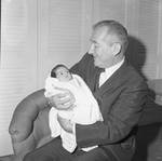 Peter W. Rodino smiles with new grandchild by Ace (Armando) Alagna, 1925-2000