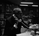 Peter W. Rodino takes a phone call by Ace (Armando) Alagna, 1925-2000