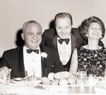 Phil Brito at table with group during Meadowbrook event by Ace (Armando) Alagna, 1925-2000